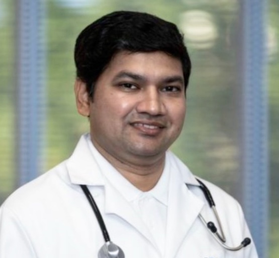 Dr. Ravi Standing For Portrait Wearing Stethoscope